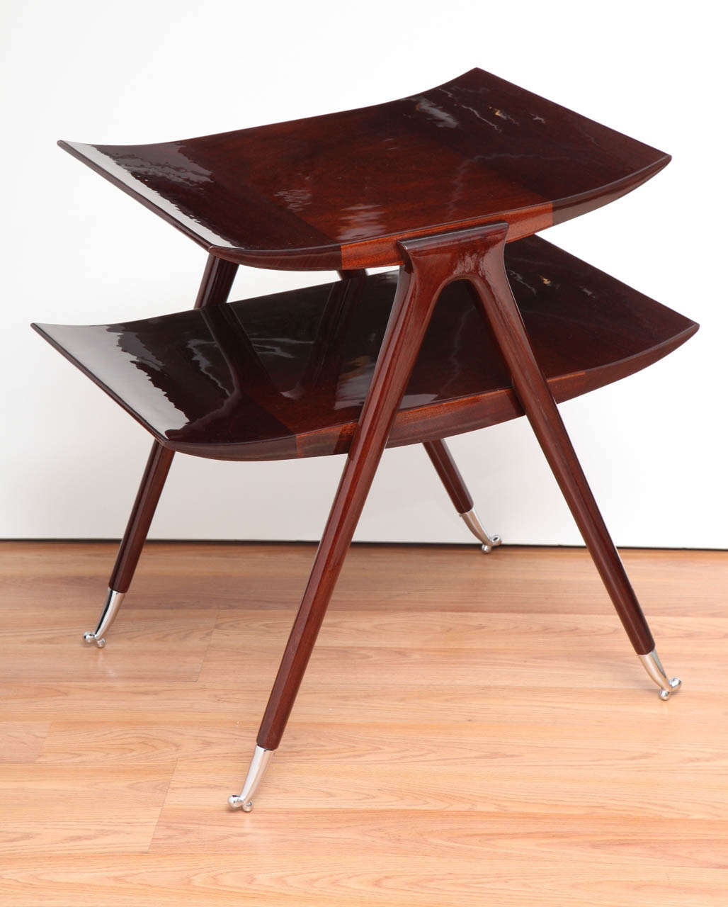 Side table in the style of Gio Ponti made in mahogany with polished chrome feet.