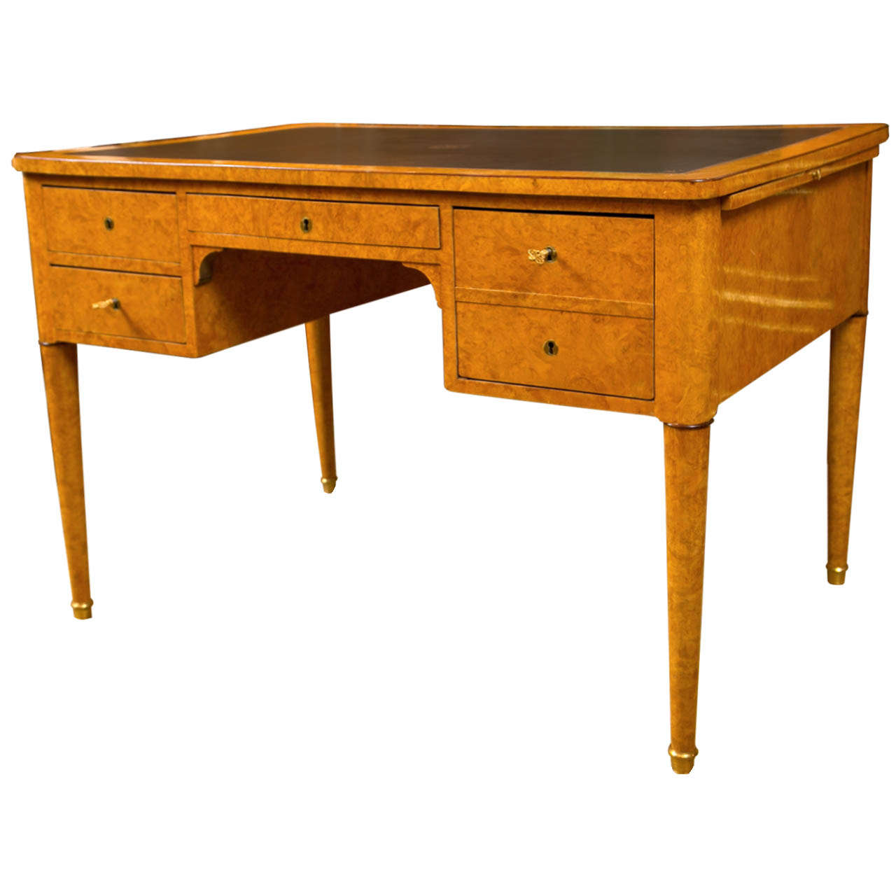 A French Charles X desk or bureau plat with barr ash and amaranth with a leather top. Great quality and secure inner compartments.