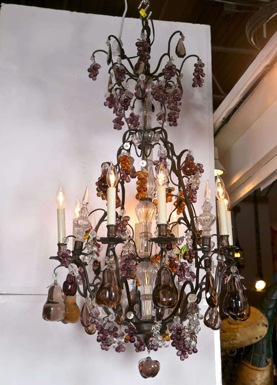 A wonderful eight light, bronze and crystal fruit decorated chandelier.