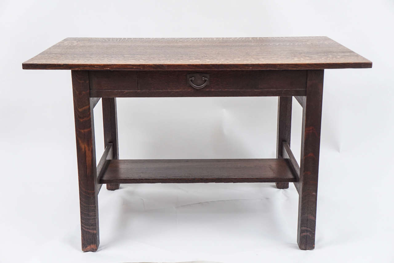 Stunning Gustav Stickley library table with branded red mark in drawer. Quarter-sawn oak and original hardware. A clean simple design that paved the way for the studio furniture we covet today.