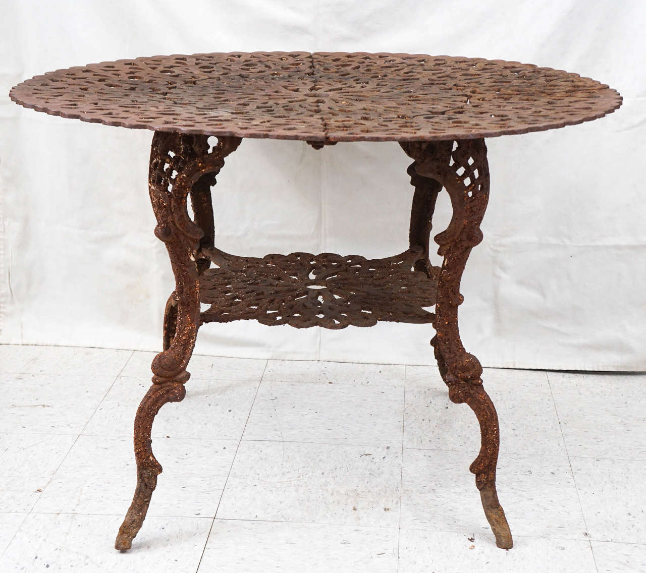 This table, most often seen as an example remake from the 1940s and 1950s, is an origin example from the 1880s the table was purchased from a well established upstate New York garden and has been in place for over 75 years. The surface is completely
