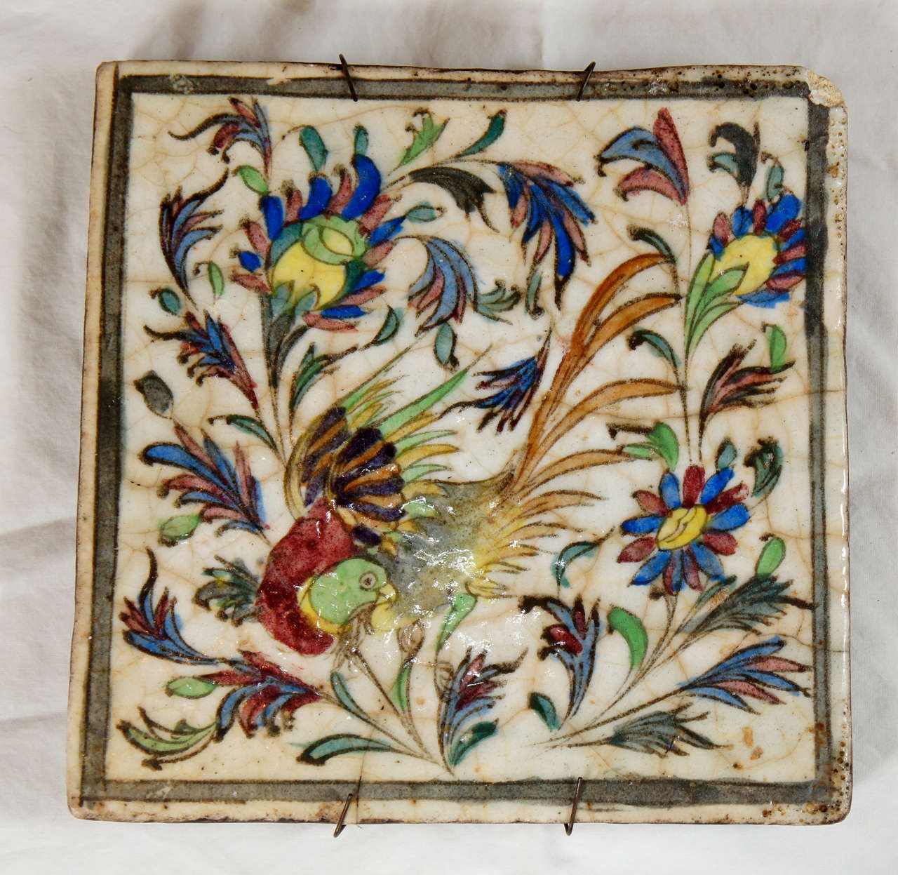 A Persian hand-painted Terra Cotta Tile