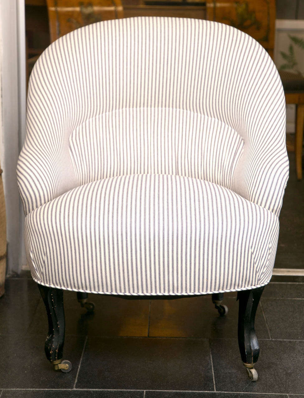 Beautiful pair of French side chairs from 19th century with new ticking upholstery and original castors..