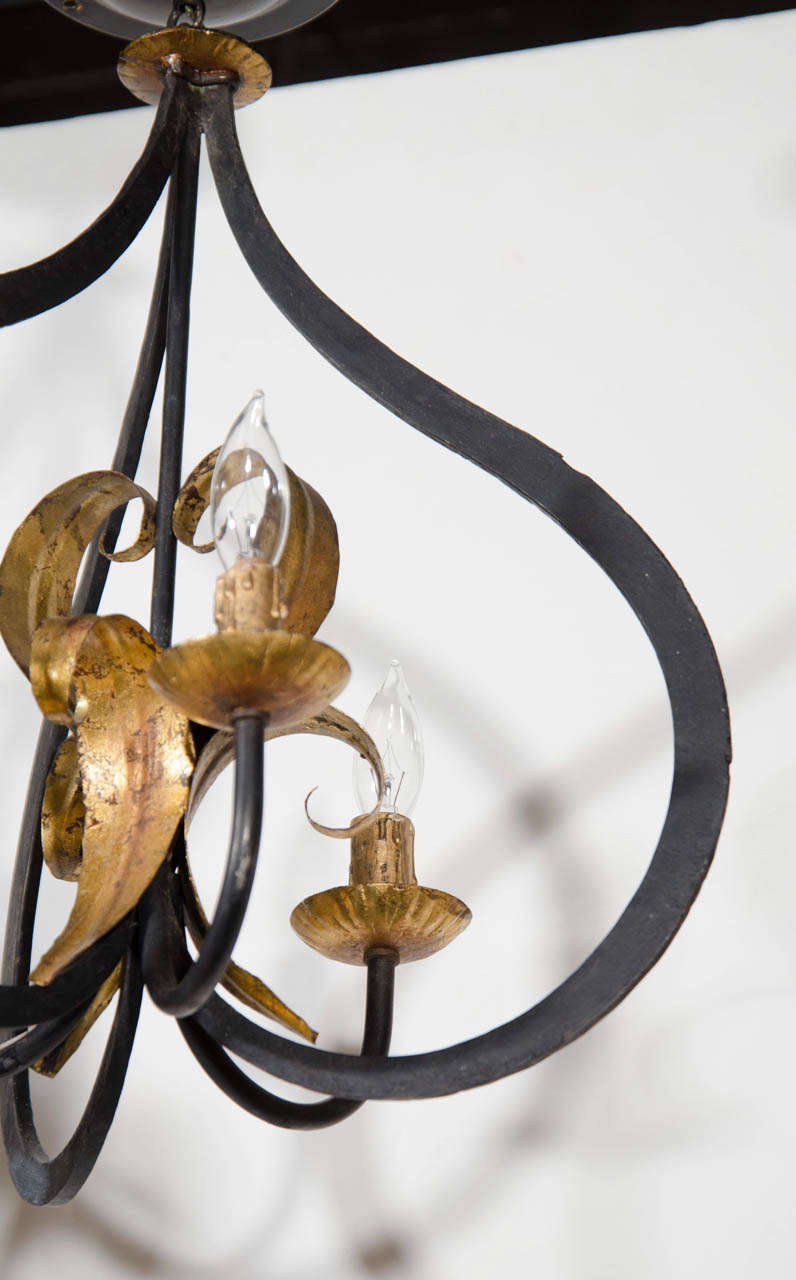 American Elegant Fleur de Lis Chandelier with Stylized Latern Form in Wrought Iron