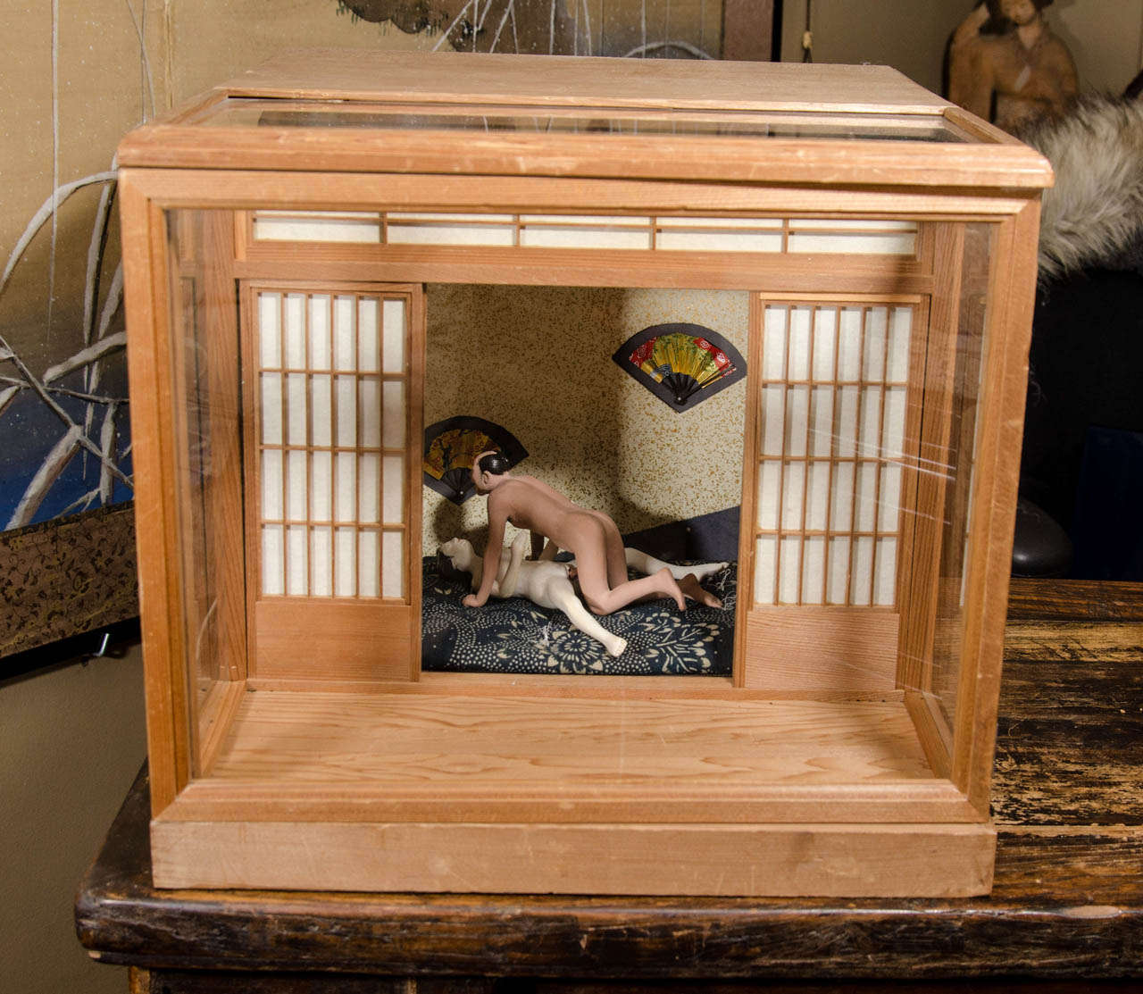A Meiji Period Japanese Erotic or Shunga wooden light box with male and female Ningyo (dolls) in sex position.

Good vintage condition with some markings to the wooden box