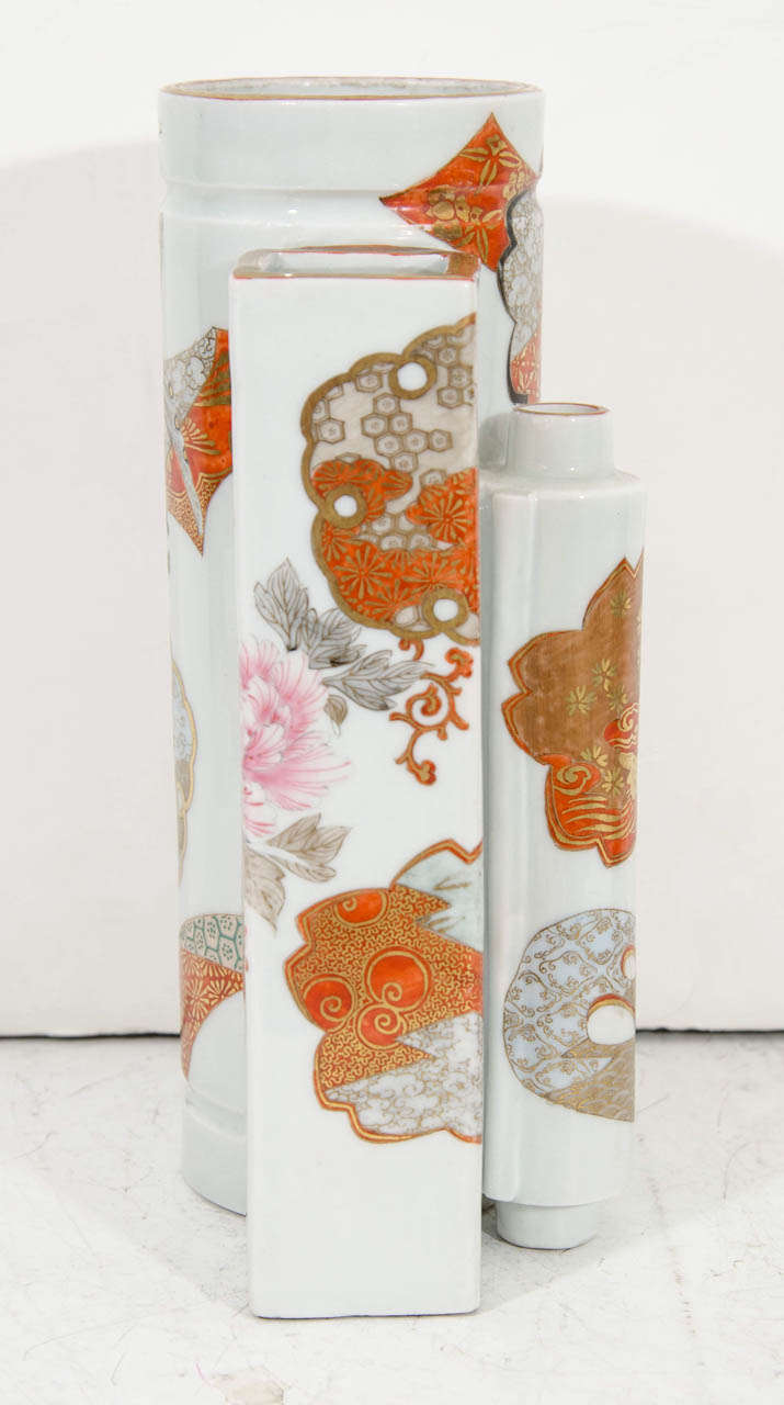 A Japanese three ways Satsuma vase, produced circa 1900s, with orange, pink, and gold ornate design. Some wear to the gold leaf. Marked on the bottom.
