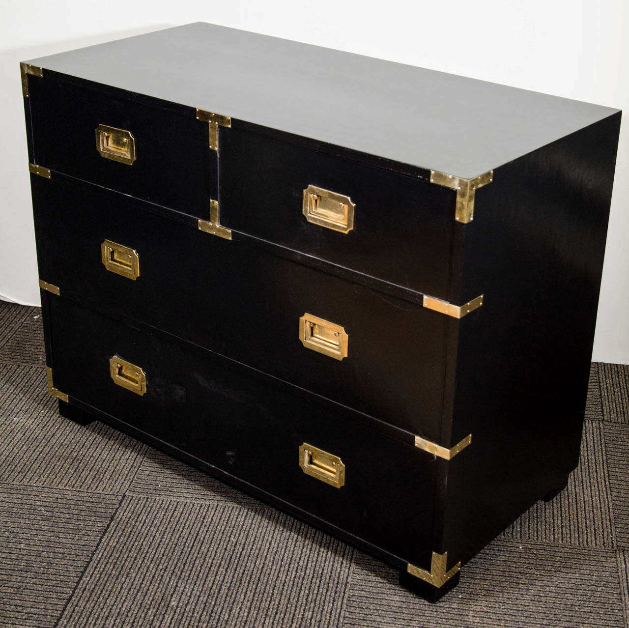 A Mid Century Black Lacquered Campaign Chest With Brass Hardware