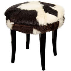 A Mid Century Stool with Cow Hide Upholstery and Ebonized Legs 4