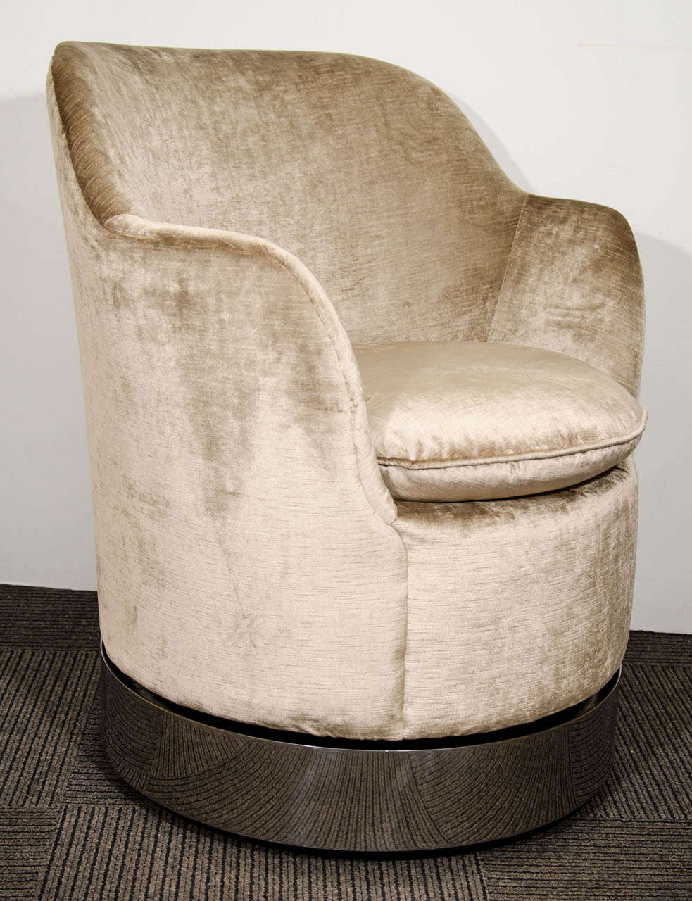 A vintage pair of barrel back cappuccino colored swivel chairs with chrome over steel base by Philip Enfield.

Good vintage condition with some wear to the upholstery and chrome finish.