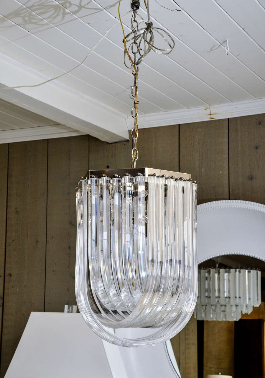 Attractive vintage clear Lucite loop chandelier.