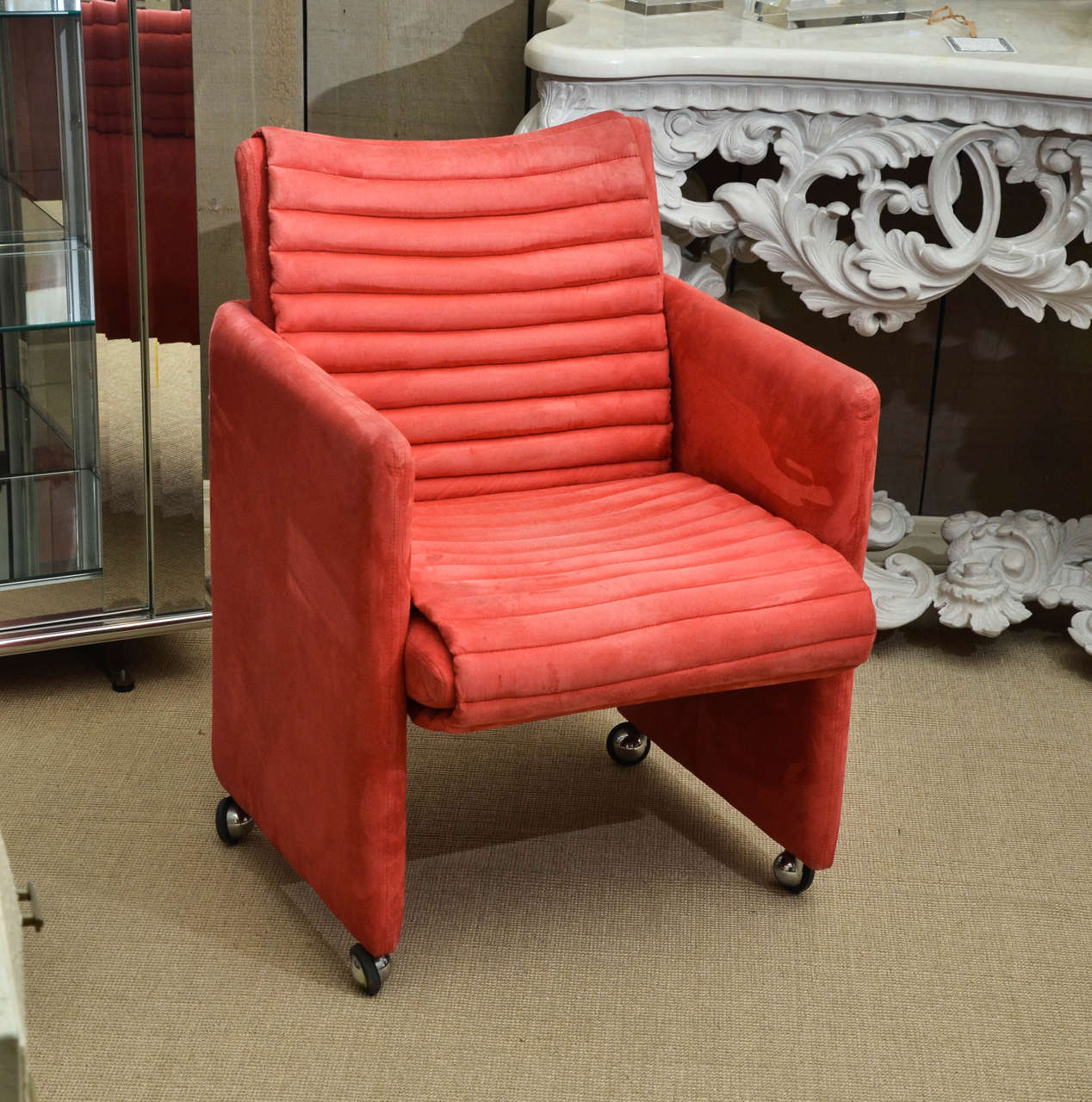 Striking pair of coral suede channel quilted arm chairs on castors by Milo Baughman for Thayer Coggin