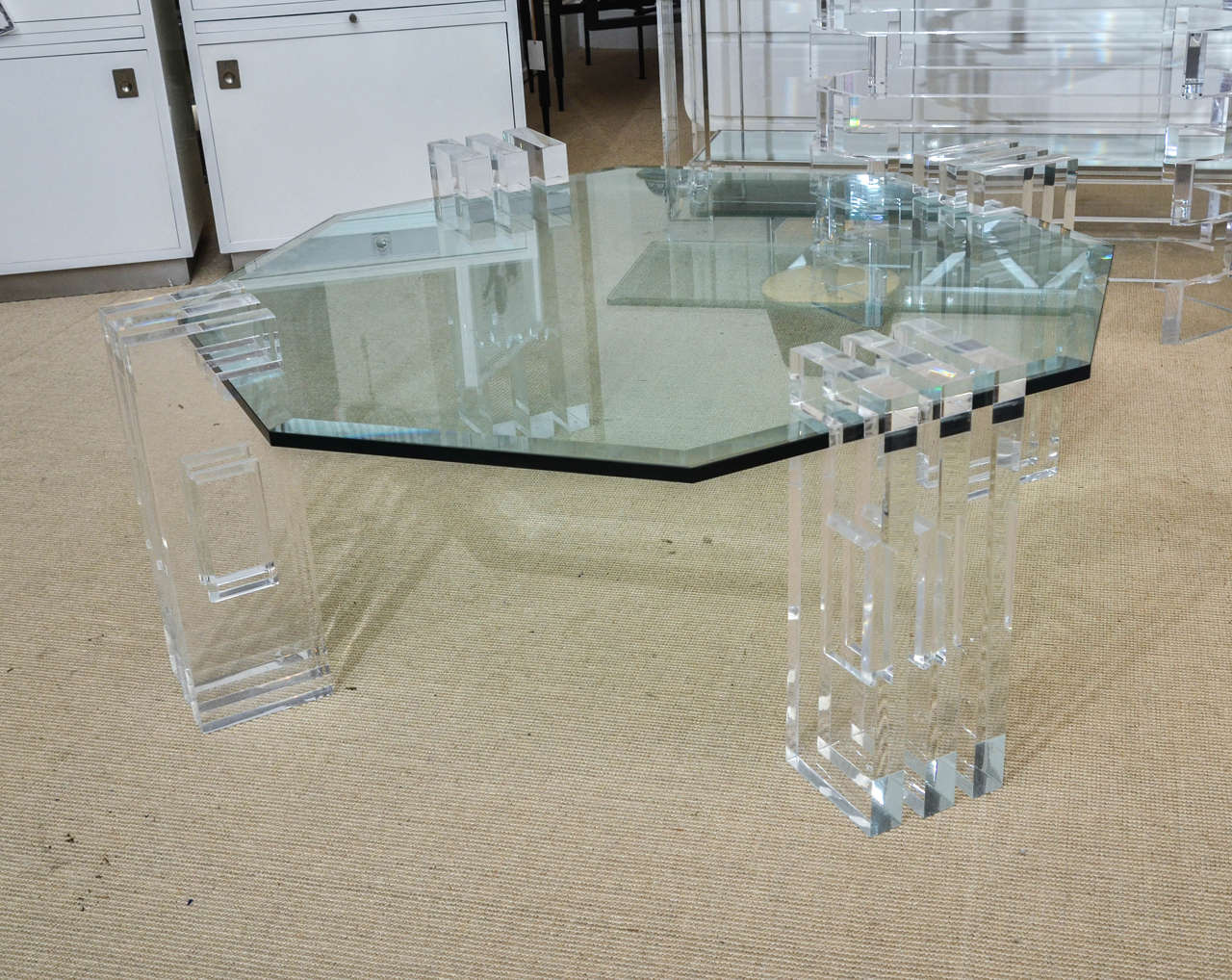 Beautiful Mid-Century Lucite and glass octagonal cocktail table with beveled glass top. The height of the glass is 15 3/4 in.