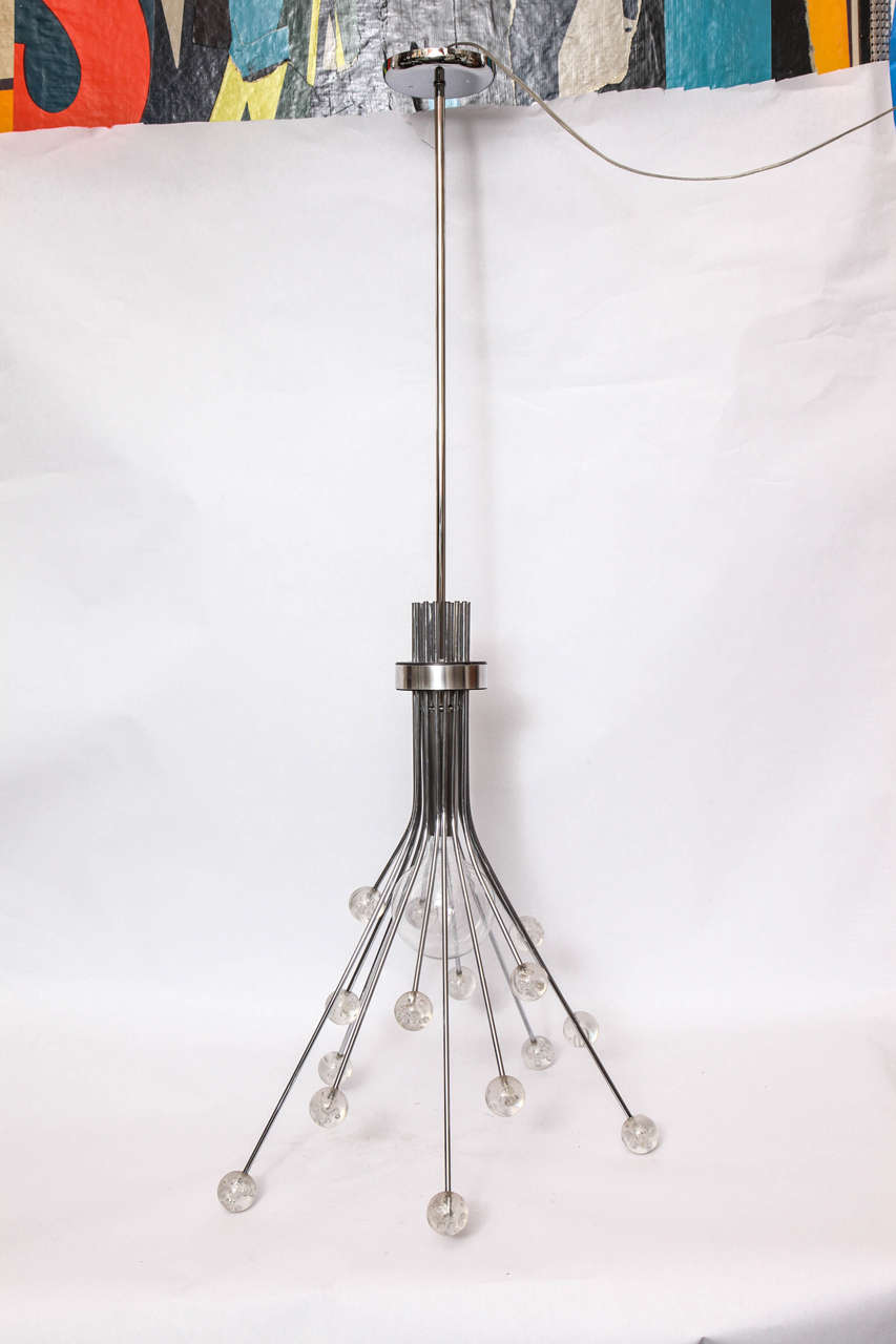 A 1970s modernist Lucite and polished aluminium ceiling fixture.