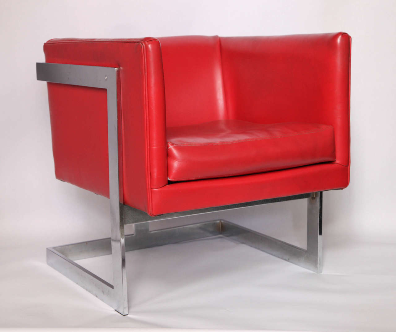 A 1970s modernist cube chair by Milo Baughman.
