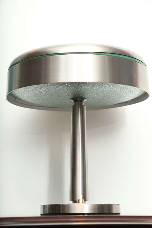 Elegant form in brushed nickel, with textured glass diffuser that creates a beautiful light.  This well documented model rarely comes onto the market and is a great example of early 60's pieces produced by Fontana Arte.  *To see our entire