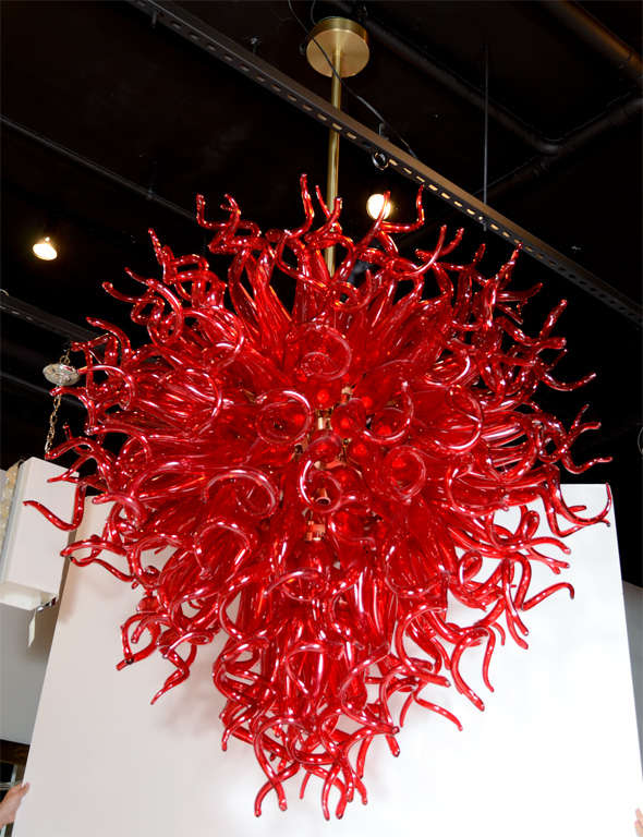 This exceptional Fuoco chandelier was handcrafted from Murano glass in Santo Stefano di Camastra on the Mediterranean sea. It features an explosion of contorting tubular forms, reminiscent of the abundance of snakes crowning Medusa's head. Each