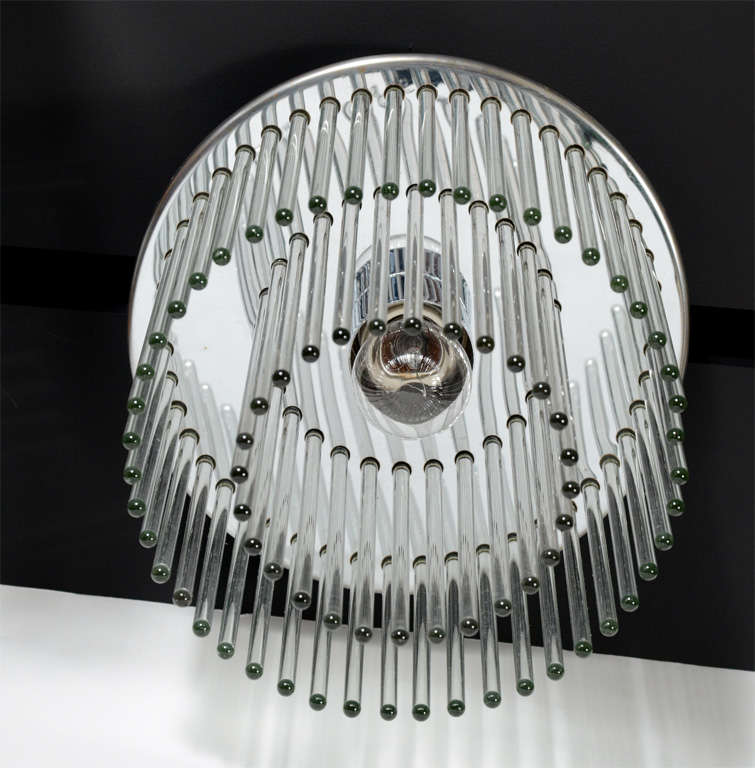 Glamorous 1970s Modernist flush mount ceiling mount fixture by Lightolier composed of attenuated clear glass rods arranged around a circular brass frame. Newly rewired.
