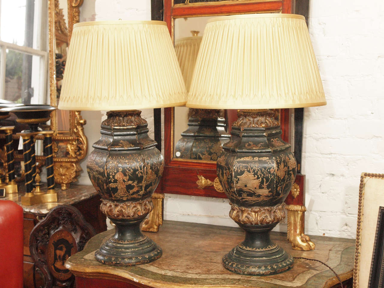 Pair of Chinoiserie Decorated carved wood urns now wired as lamps with smocked silk shades.