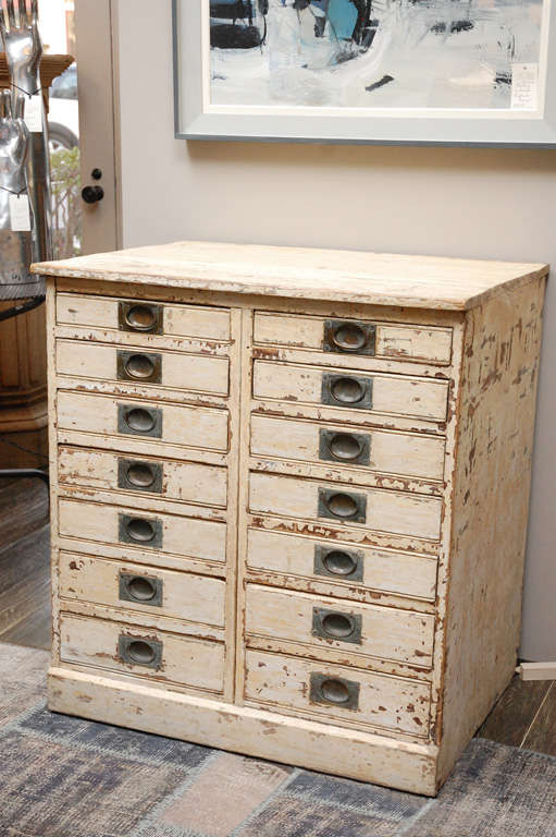 1860s English collector's drawer cabinet chest. 14-drawer painted plinth base chest with brass pulls. Serves as a multi-drawer cabinet, chest, or small sideboard.