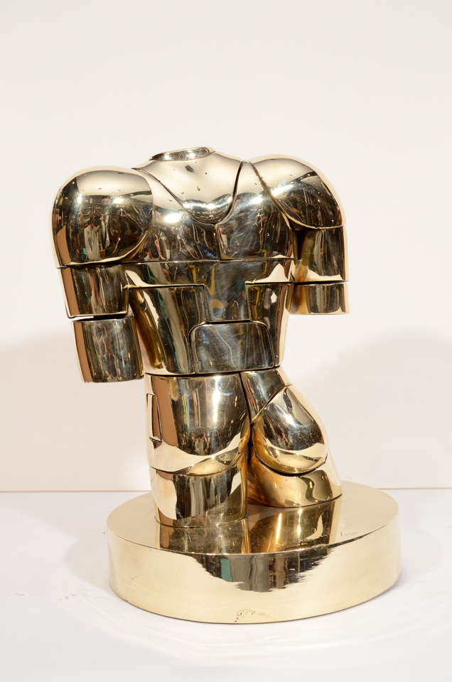This Puzzel sculpture was made by miguel Berrocal . It is the sculpture that is featured on the cover of his book.
