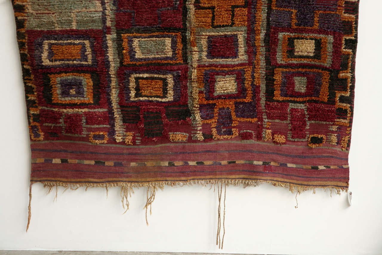 Moroccan rugs, crafted by women in the interior plains and mountains on fixed-heddle looms can vary greatly depending on the tribes that weave them. Nonetheless, they all use severely geometric Moroccan decoration, sometimes in muted tones,