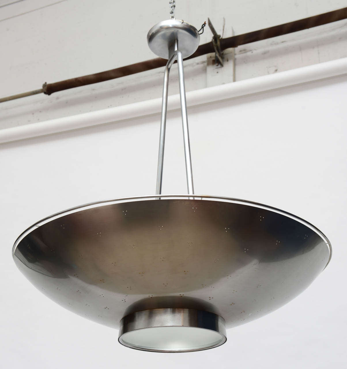 A rare Example of Finnish Lighting.
Plated brass.a delicate banded gallery and monumental size are the unusual design components exhibited.
