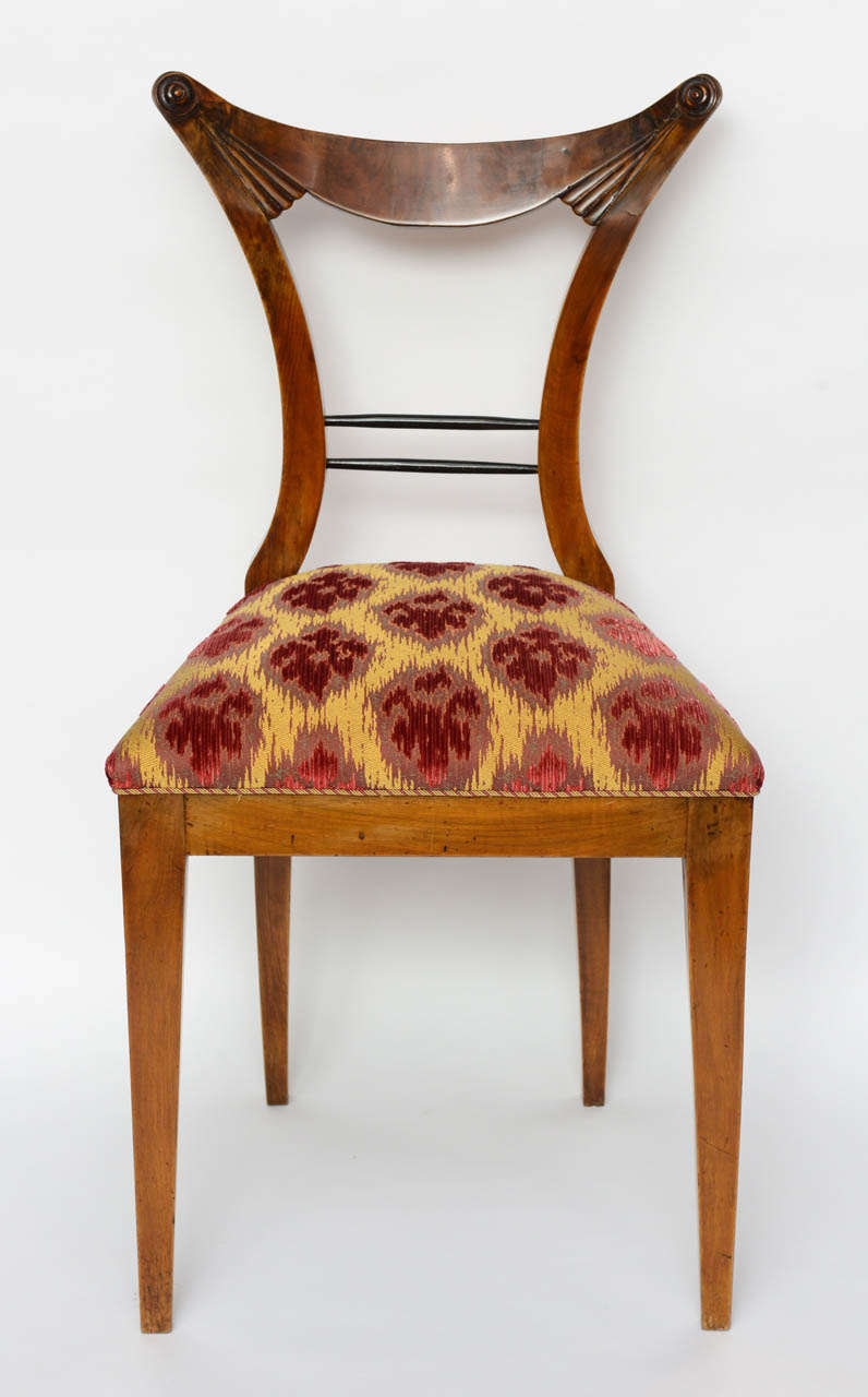Set of six Biedermeier dining chairs, Josef Danhauser, Vienna. The stylized back over paring legs.