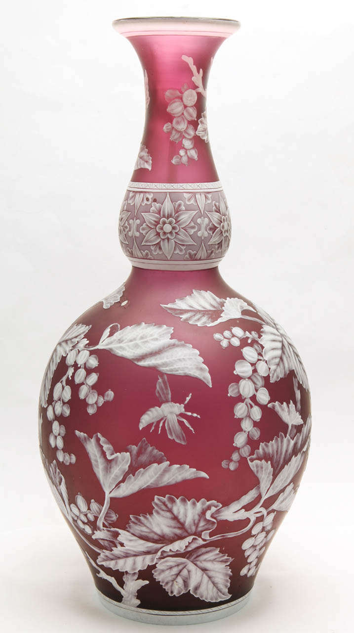 An important unsigned Stevens & Williams  light purple and white cameo glass double gourd vase carved with flowers, fruit and bees, the carving attributed to William Northwood