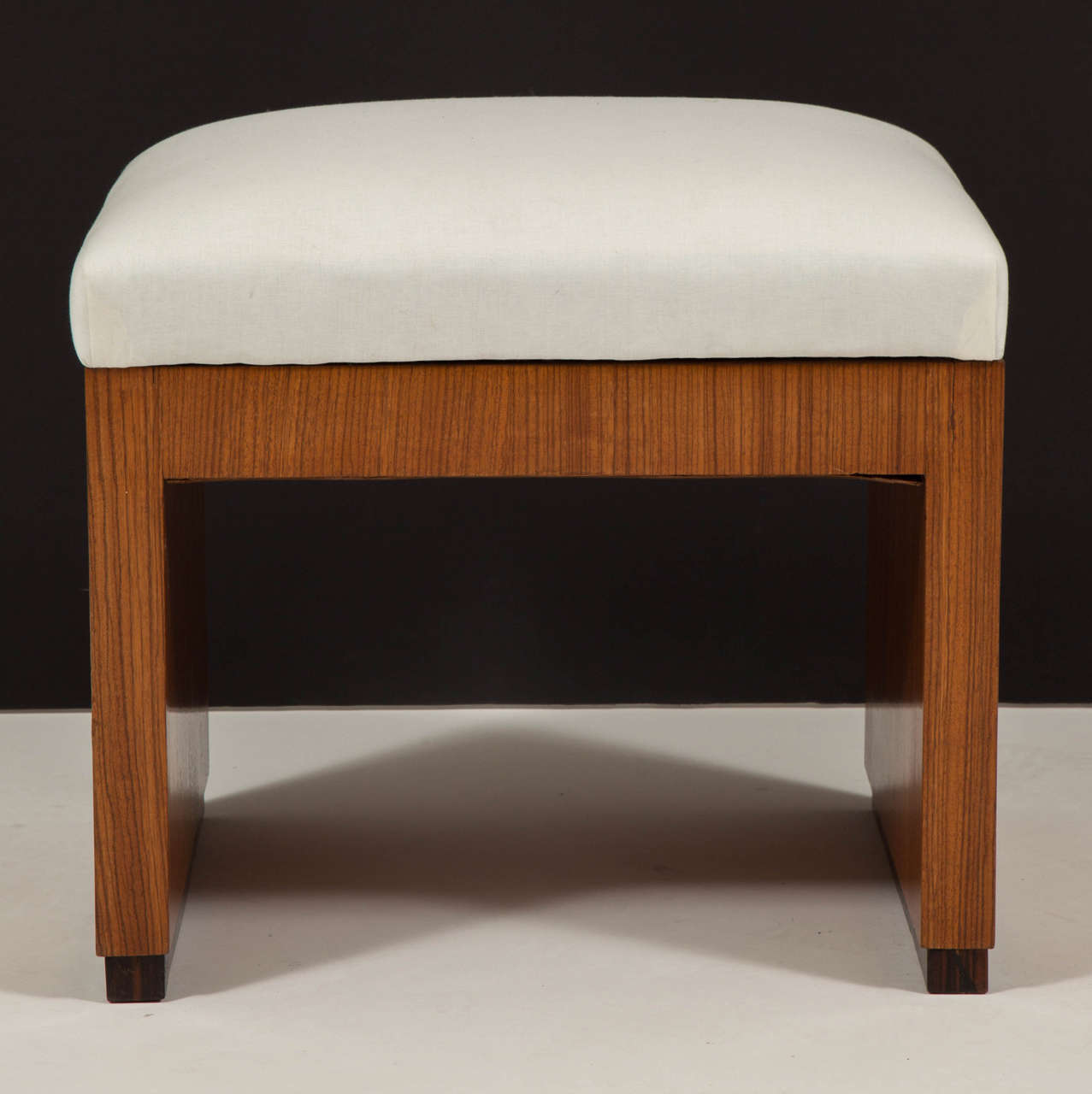 Early 20th century Art Deco style palisander bench, upholstered seat on rectangular base.