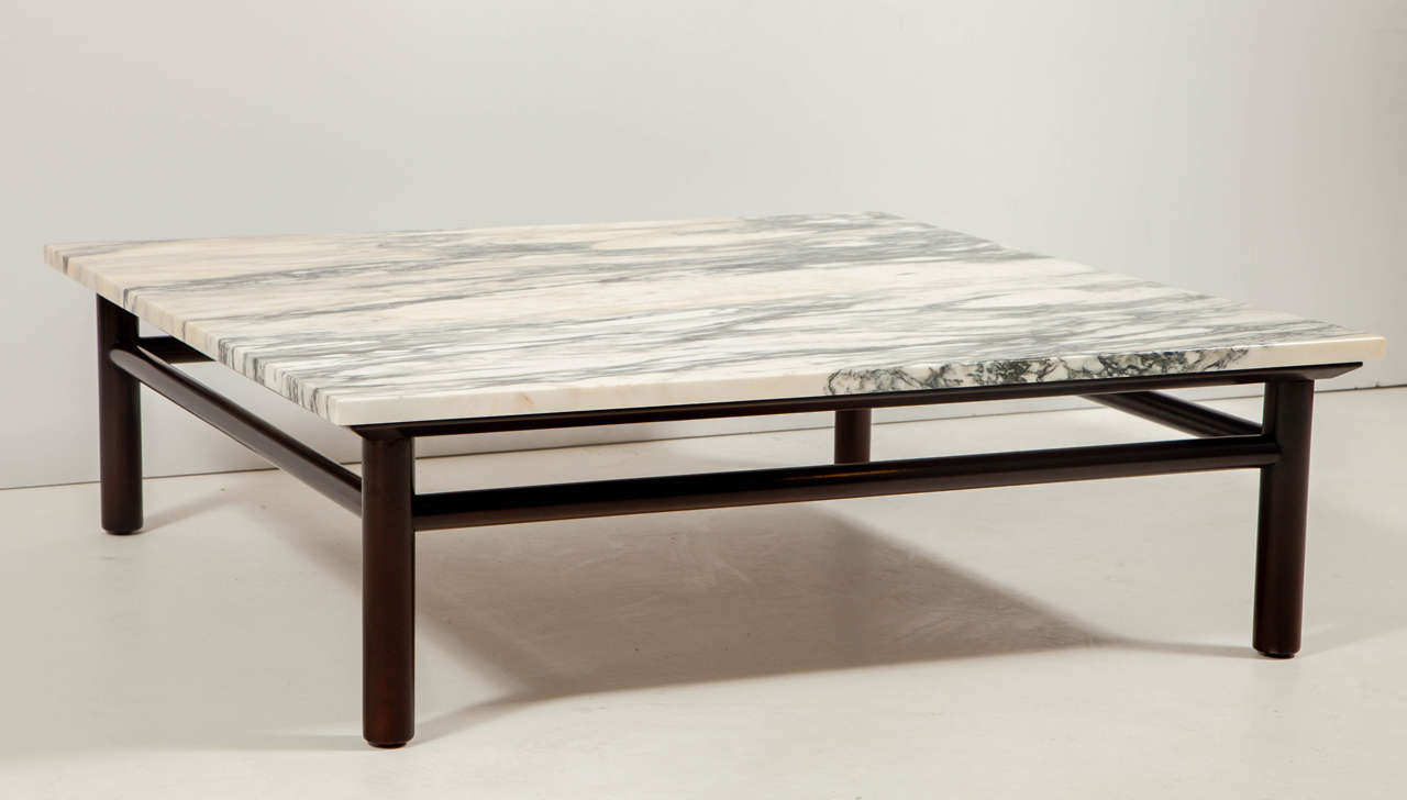 Mid-Century classic dark brown stained Walnut dowel framed coffee table with original creamy white marble top with tonal grey and honey tones. On display at 1stdibs at NYDC, 200 Lexington Ave.