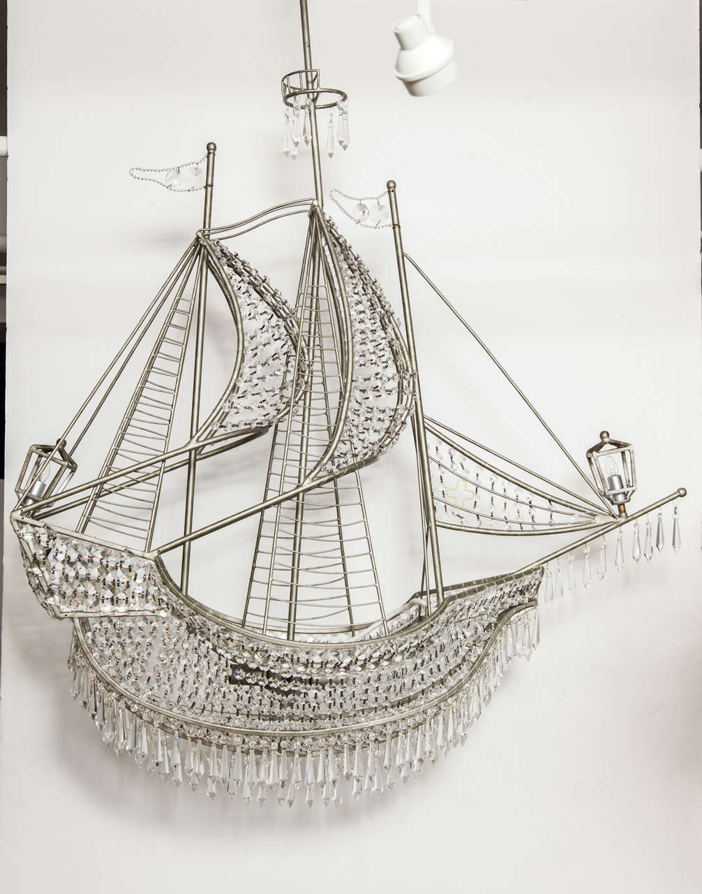 Fantastic and impressive scale ship chandelier with crystal details. Chandelier has four light sources within the body and two at stern and bow.