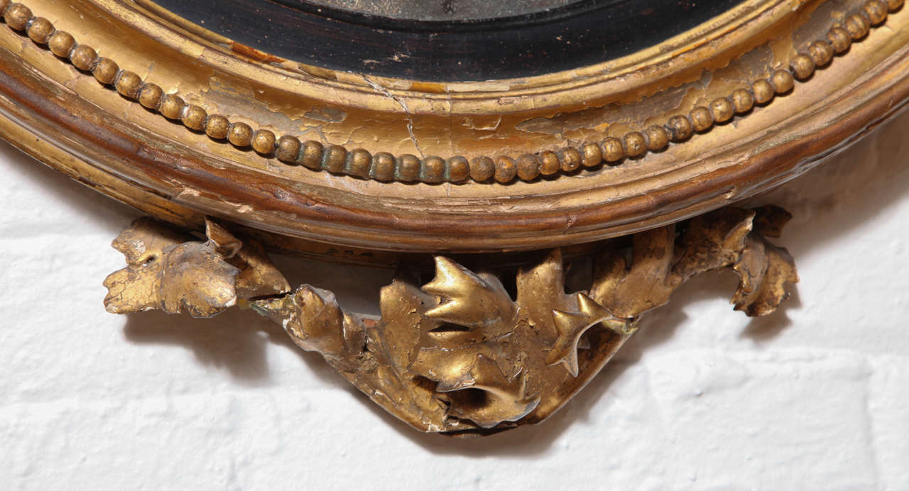 Mid-19th Century A Carved, Gilded and Ebonized Bullseye Mirror, England c. 1850 For Sale