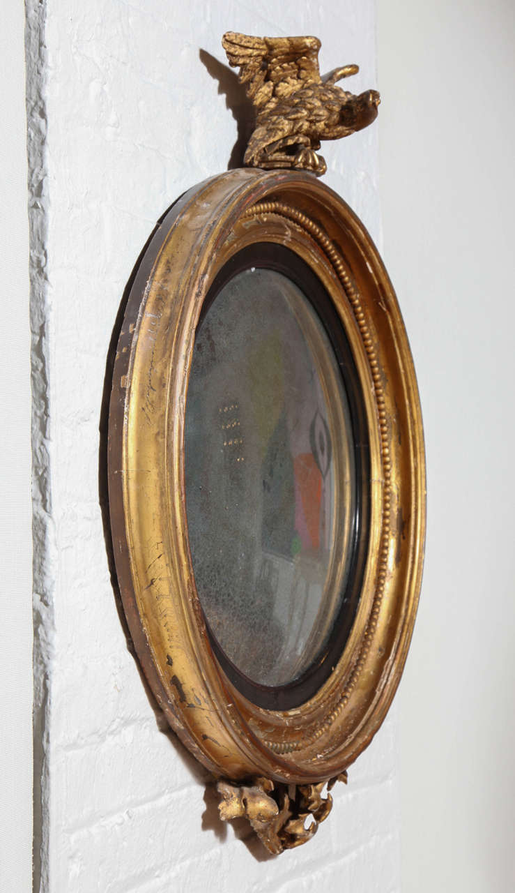 Wood A Carved, Gilded and Ebonized Bullseye Mirror, England c. 1850 For Sale