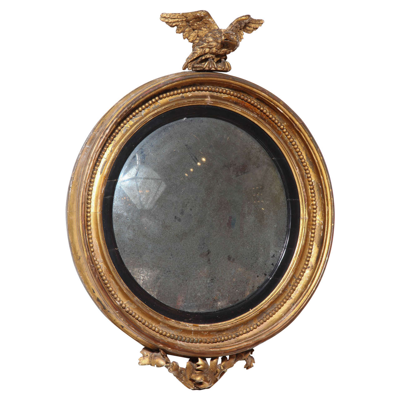 A Carved, Gilded and Ebonized Bullseye Mirror, England c. 1850 For Sale