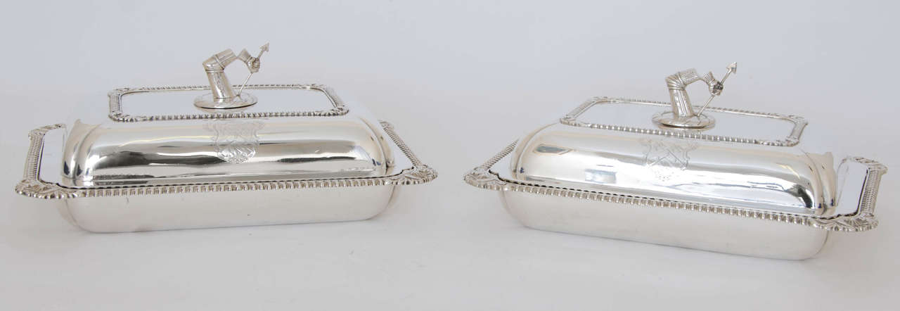 Pair of Antique Silver George III oblong Entree Dishes , the gadrooned borders have shaped and foliate cased corners, the covers are engraved with crests, armorials and ribbon mottos ” Fortuna Audaces Juvat” (Fortune favours the brave). The arms of