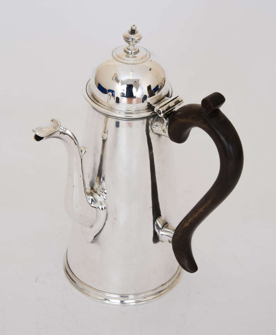 Antique Silver Side- handled George I Coffee / Chocolate Pot made by Joseph Clare of London in 1721. This elegant pot is of plain tapering cylindrical form and stands on a circular collet foot.  It has a wooden handle, a knop finial and a swan neck