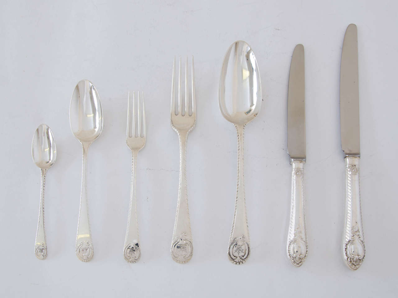 Antique Silver Service of Flatware , Extremely Rare Eighteenth Century Feather Edge and Cartouche Carrington Shield Pattern” All engraved with a family crest.
All Made in 1778-1780 in London
6 Tablespoons & 2 Dessert Spoons 1763)
 Comprising:
12