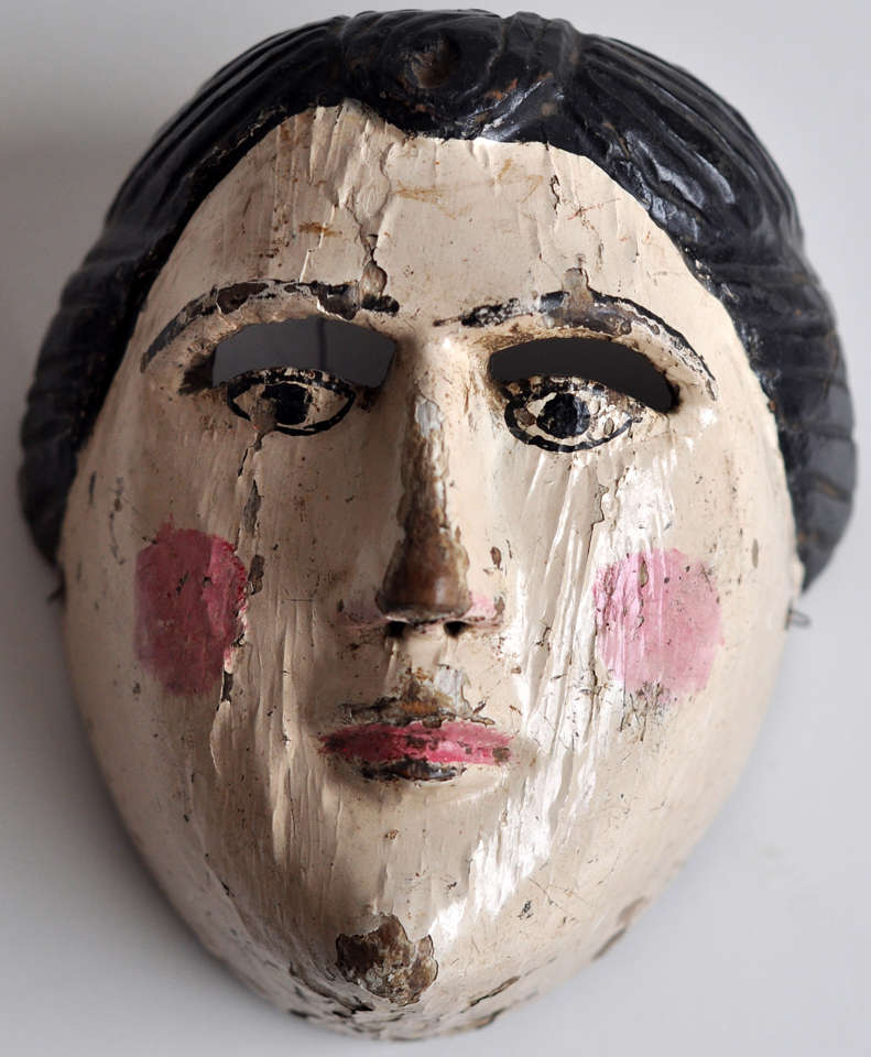 Beautifully carved and painted wood mask, probably ceremonial, from Central America.