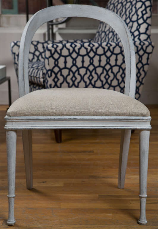 Gorgeous set of 12 painted wood frame dining chairs from France. Newly upholstered in beige linen.