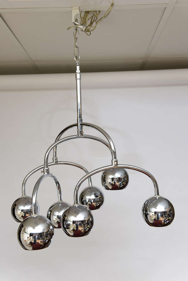 Robert Sonneman seven-light chrome tiered chandelier. There is movement and illumination in this beautiful chandelier.