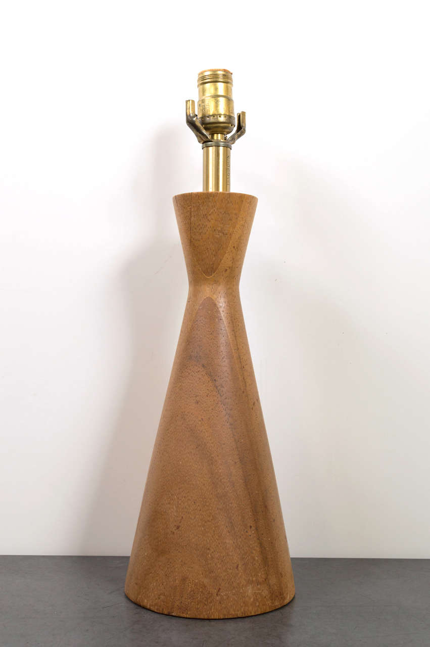 Lovely wood turned table lamp made of teak.  Recently rewired.