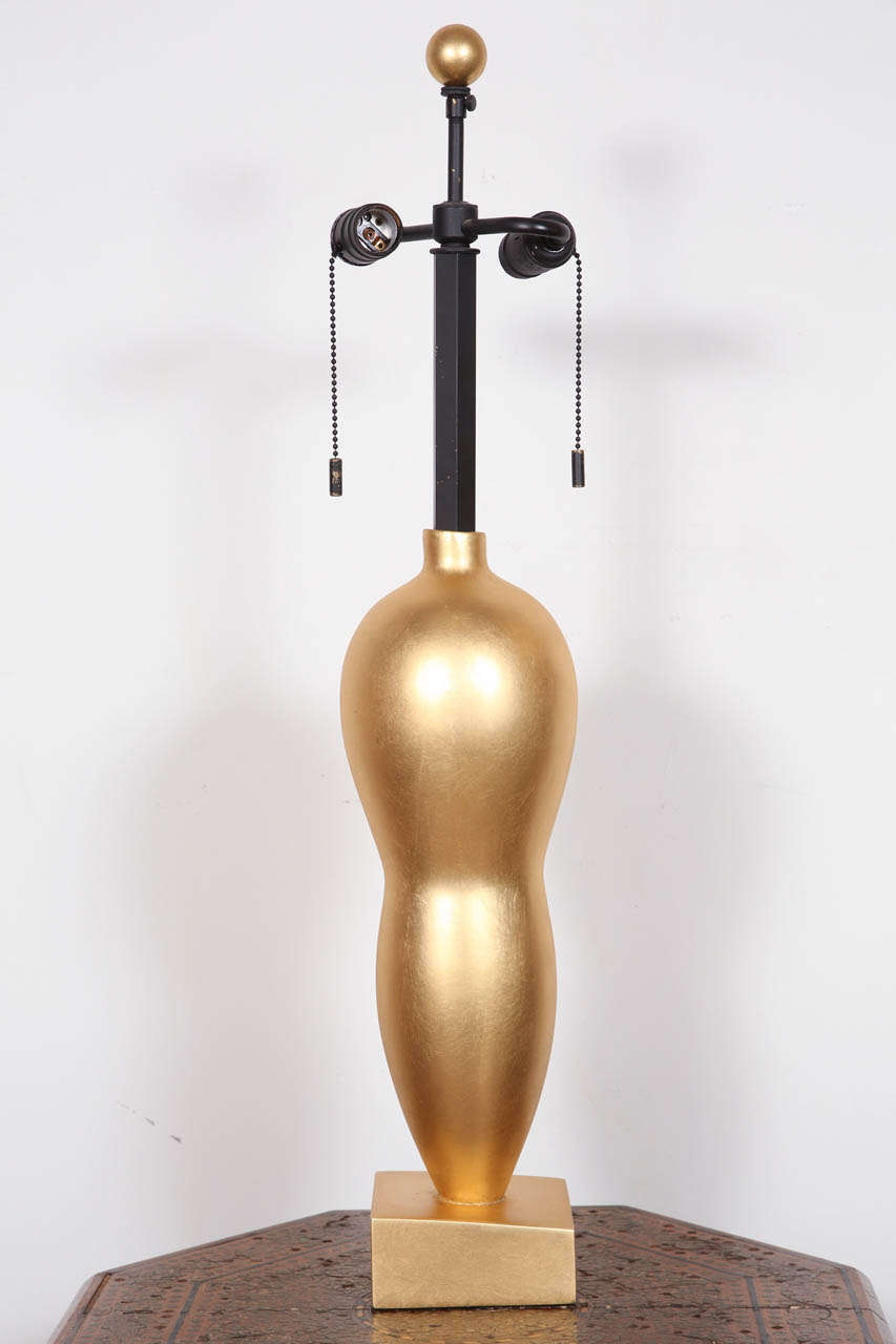 Fabulous Pair of gold Rafaela table Lamps in inverted pear-form glass body overlaid with pure gold leaf, set on a sloping wooden base.
Mod. no. 800001-05.
American Circa 1970's Original Table lamps By John Hutton for Donghia.
Beautiful vintage