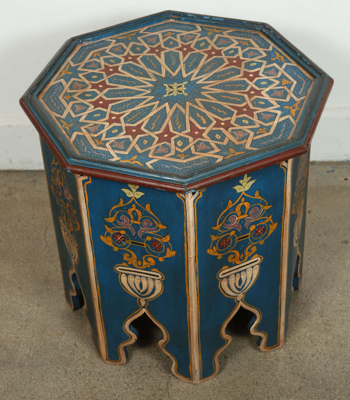 Moroccan blue colorful hand-painted side table with Moorish design. Blue background with multicolored floral and geometric designs. Very fine artwork on an octagonal shape base. You can use them as night stand or side table. This exotic side tables