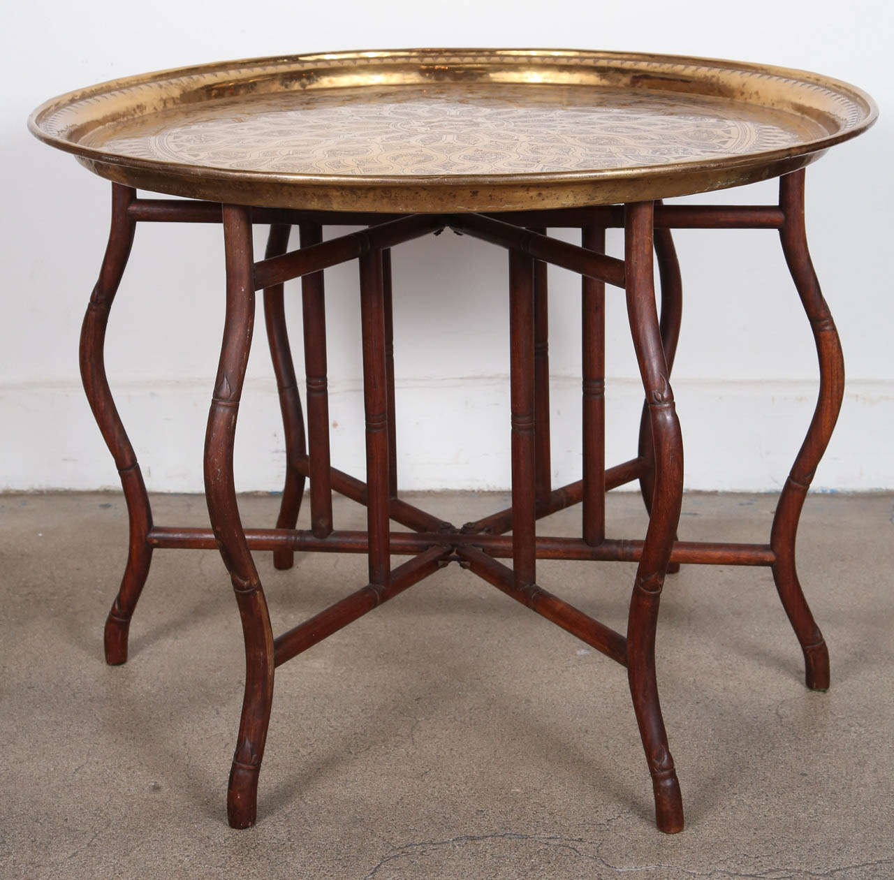 Very hard to find large Persian polished brass tray table on bamboo folding base, could be use as a coffee table or low dining table, this is how they use them in Morocco, Syria, India, Egypt and in the Middle East to serve food or tea.
Great for