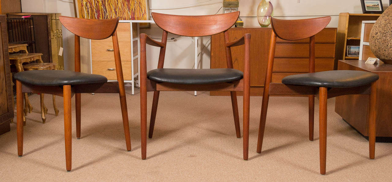 Very nice set of six Teak dining chairs, Harry Ostergaard for Randers Mobelfabrik. Two arm, and four side. Seats have been reupholstered in a high grade black leather.