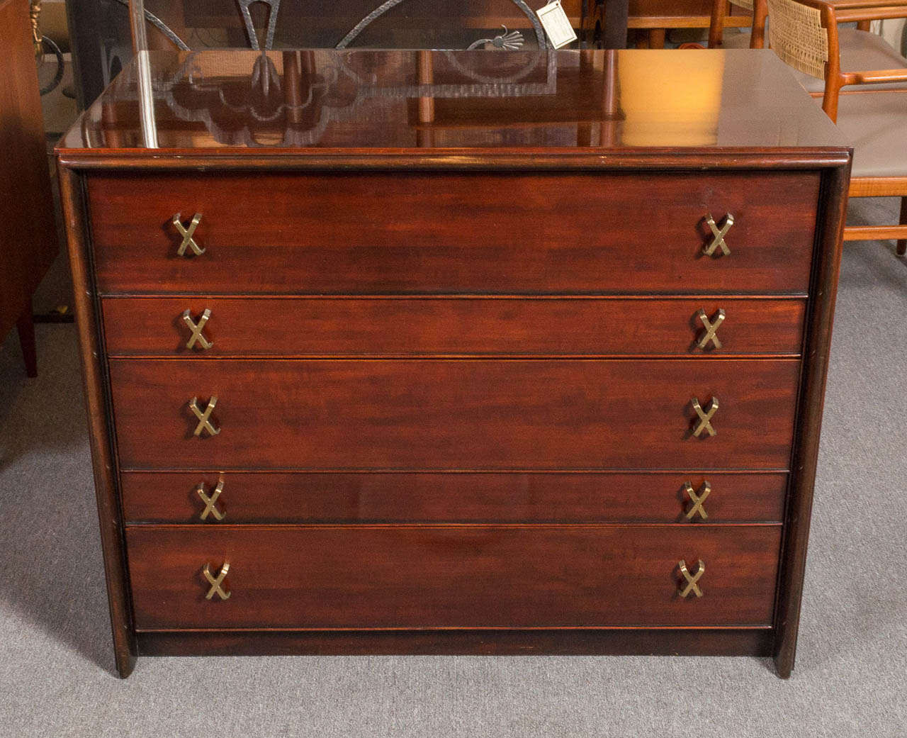 Offering a wonderfully scaled five drawer chest designed by Paul Frankl for Johnson Brothers furniture.  The chest maintains it's original mahogany stained and lacquered finish.