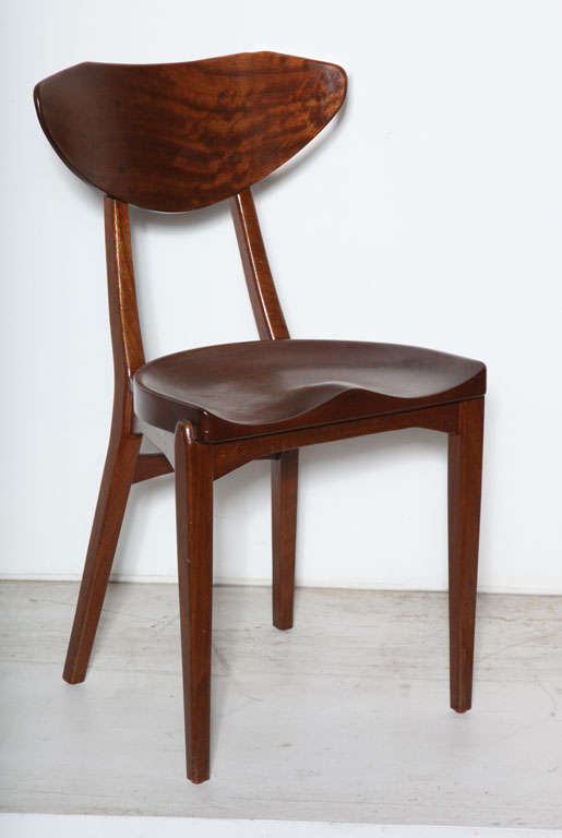 Vintage 1950s Danish Dining Chairs, Set of 6 

This set of mid century dining chairs feature solid mahogany tractor seats, solid mahogany frames and steam bent backs. Incredibly comfortable because it molds to the body. Please note the sculpted