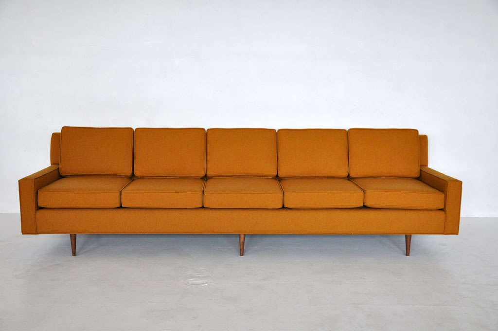 Extra long 5 seater sofa.  Mid-century modern by Selig.  Arms flare up from back.  Similar to style of Paul McCobb sofas.