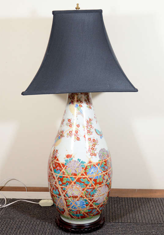 A pair of large Japanese porcelain vases with colorful bird and flower designs (varied on each piece) that have been converted into lamps.

4829