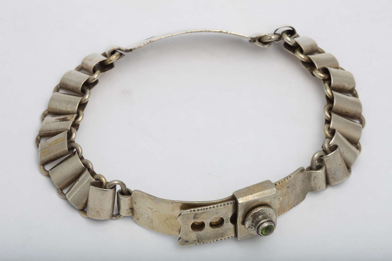 French, 19th century, silver plated dog collar with peridot stone, circa 1880's; 14 inches in length when open. Very good condition.